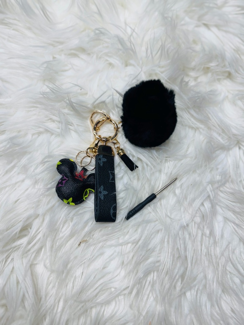 Black Faux Fur Pom Pom Keychain with Black Leather-Look Strap and Charm